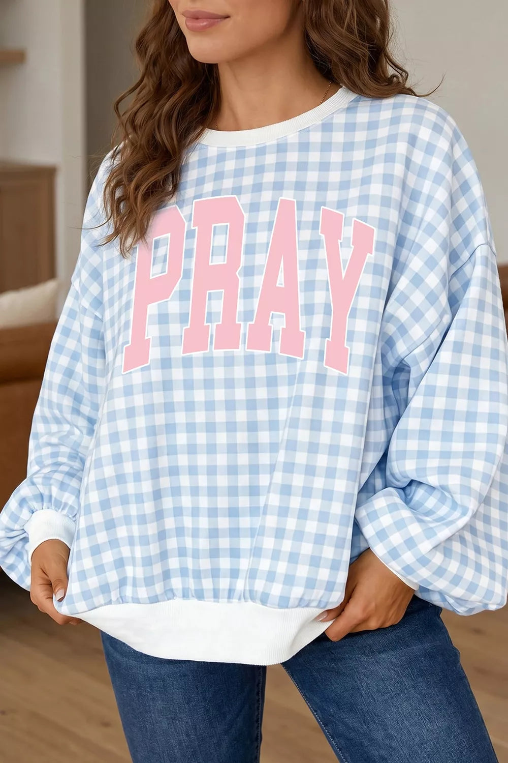Women's round neck sweatshirt with "PRAY" slogan graphic, stylish and comfortable from Trendsi.