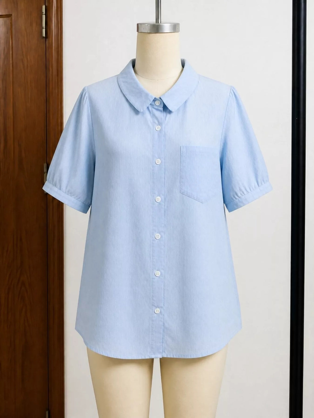 Plus size short sleeve button-up shirt from Trendsi, featuring a full-size tops design with a classic collar and front buttons.