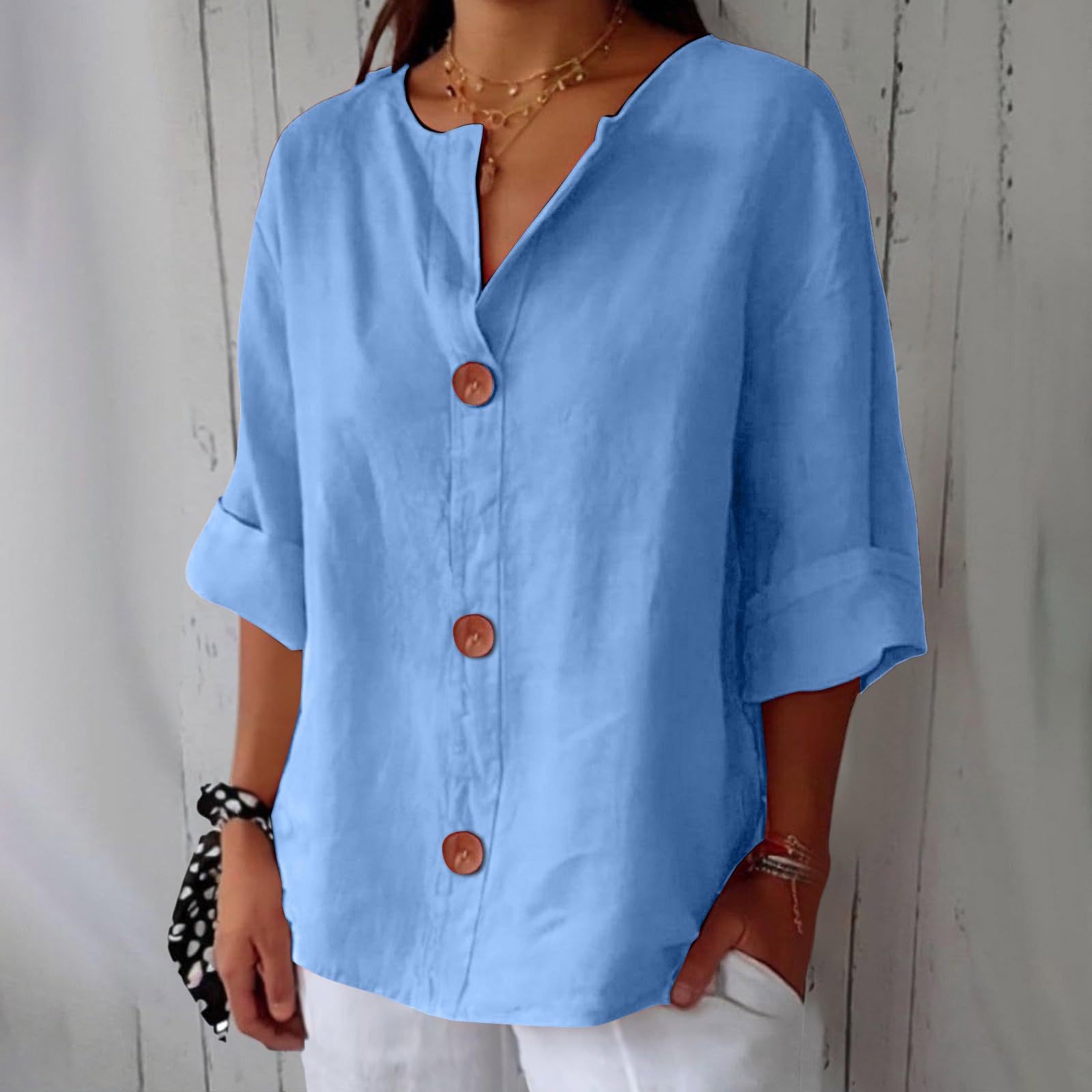 Women's V-neck buttoned blouse by FitiqueFit, casualwear style, shown in a light fabric with long sleeves and front buttons.