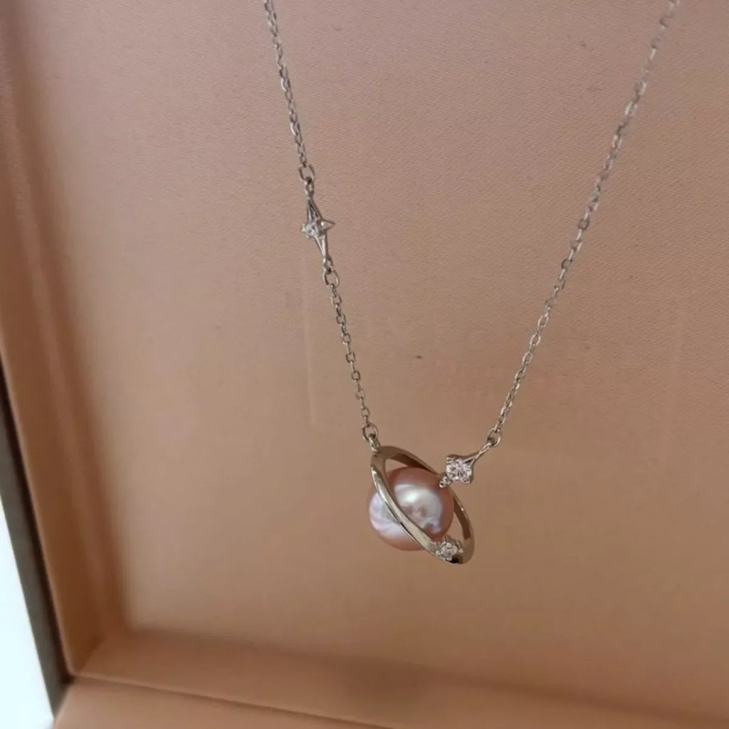 Planet Pearl Pendant Necklace by Shopimist featuring a luminous pearl pendant on a delicate chain.
