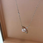 Planet Pearl Pendant Necklace by Shopimist featuring a luminous pearl pendant on a delicate chain.