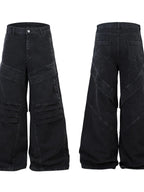 Men's wide leg denim jeans by Plush Fashion Shop, displayed hanging with focus on relaxed fit and classic blue denim fabric.