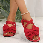 Shopimist bow embellished flat sandals showing a stylish design with decorative bows on a sleek, comfortable flat sandal style.