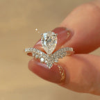 Sterling silver ring with 1.5 carat moissanite gemstone, showcasing a sparkling round cut design on a white background.