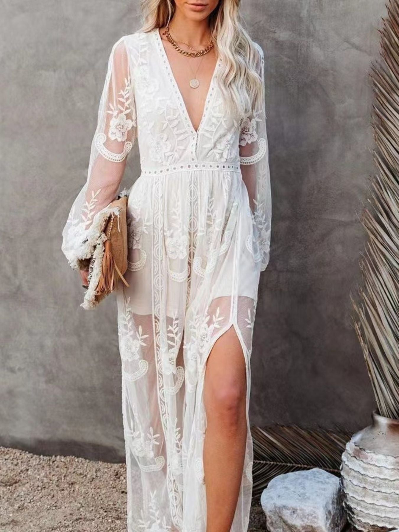 Elegant floral lace high-slit maxi dress by Trendsi, featuring intricate lace details and a flowing evening gown design.