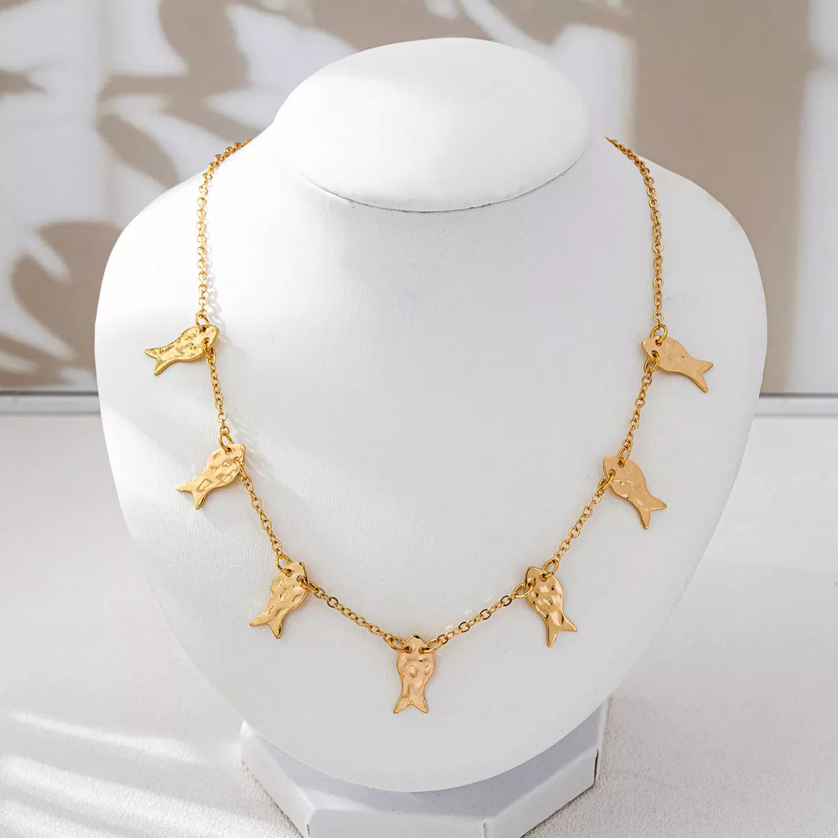 18K gold-plated fish charm necklace from Plush Fashion Hub featuring a delicate fish pendant on a fine chain.