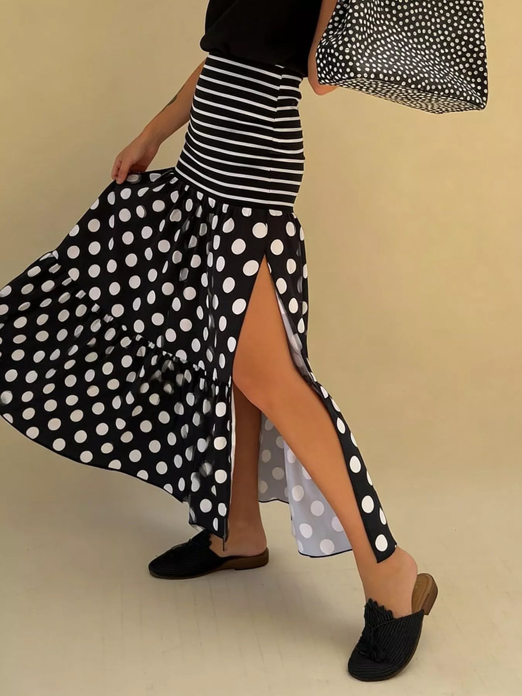 Flowy women's polka dot striped maxi skirt with slit, casual bohemian style, featuring lightweight fabric and relaxed fit.