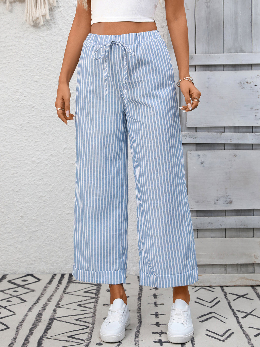 Women's striped wide-leg drawstring pants with pockets, trendy and comfortable, made by Trendsi.