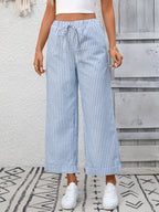 Women's striped wide-leg drawstring pants with pockets, trendy and comfortable, made by Trendsi.