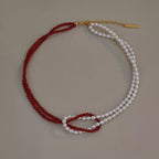 Double layered knot necklace by Shopimist featuring two delicate gold chains and intricate knot designs.