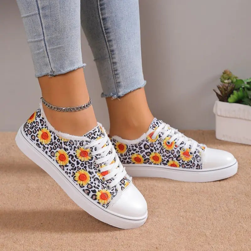 Women's low top floral canvas shoes by Trendy Attic Store01 with breathable design, featuring colorful floral patterns.