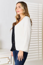 Women's V-neck knit cardigan with contrast buttons and angel wing woven detail, stylish layering piece by Trendsi.
