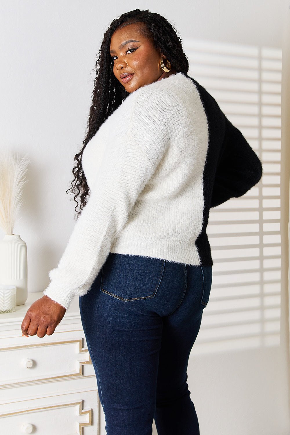 Women's V-neck knit cardigan with contrast buttons and angel wing woven detail, stylish layering piece from Trendsi.