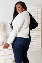 Women's V-neck knit cardigan with contrast buttons and angel wing woven detail, stylish layering piece from Trendsi.