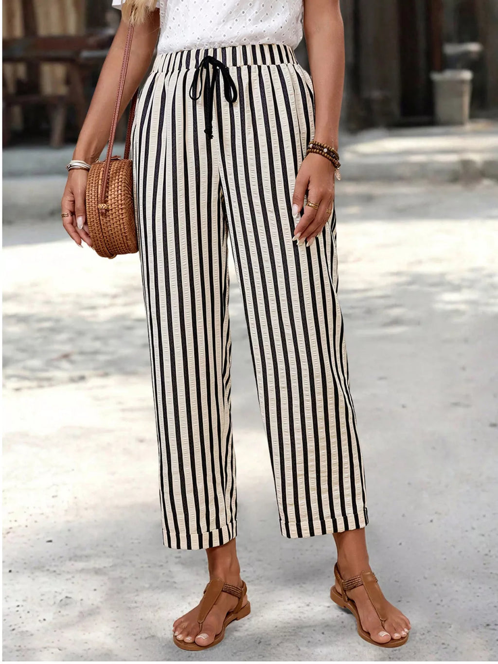 Women's striped high-waisted cropped pants with pockets from Plush Fashion Hub, featuring a stylish striped pattern and tailored fit.