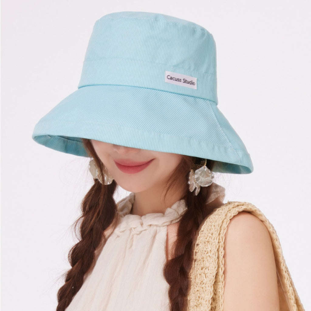 Wide brim straw sun hat by Trendsi featuring a stylish design, perfect for summer beach vacations and outdoor sun protection.