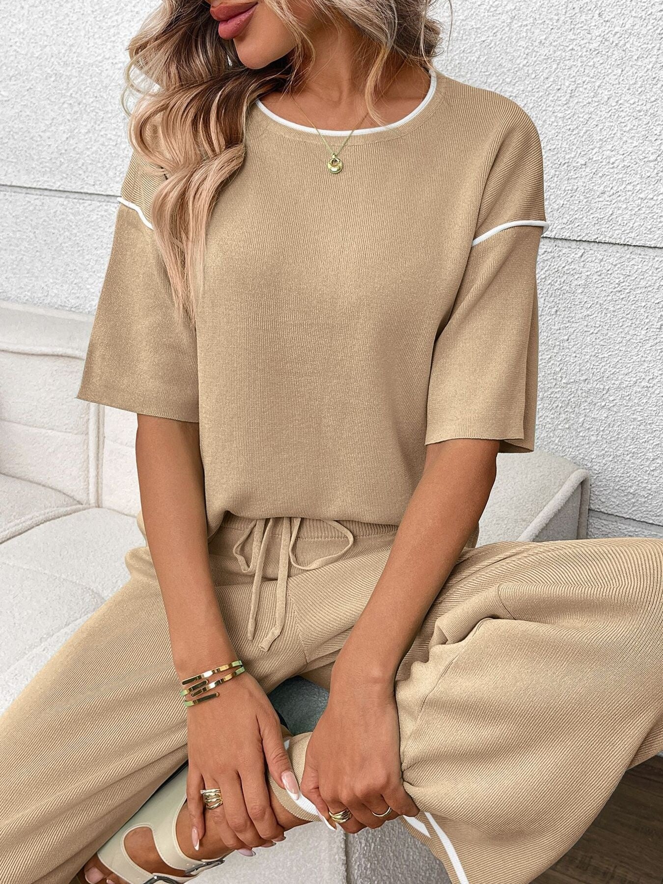 Women's casual two-piece lounge set with round neck top and drawstring pants, trendy and comfortable from Trendsi.