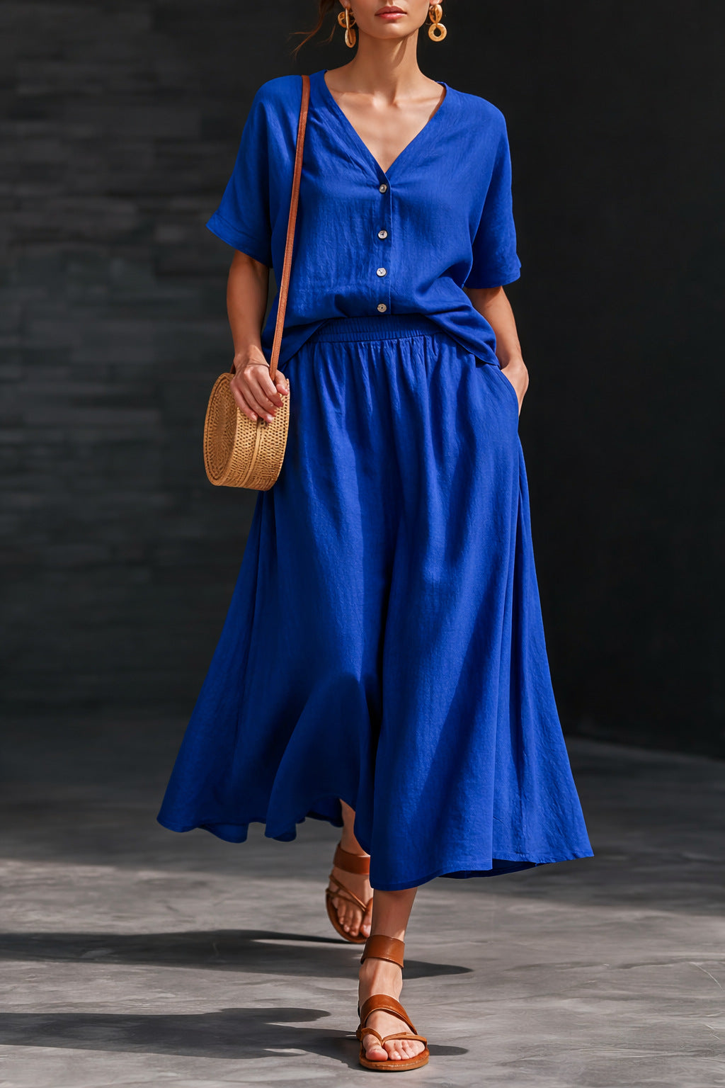 Women's V-neck button-up top and long skirt set by Plush Fashion Hub, casualwear with a relaxed fit and stylish design.