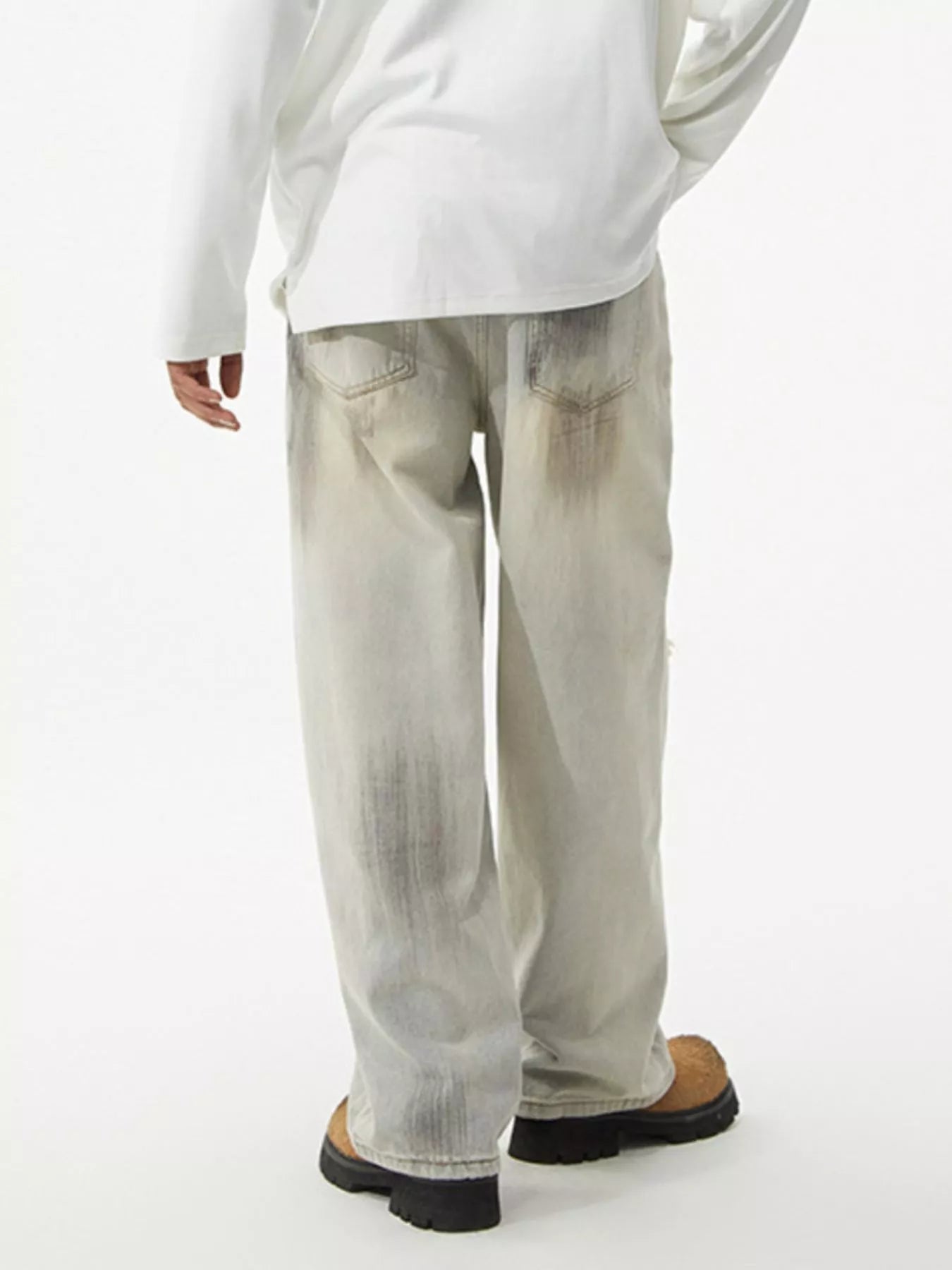 Men's distressed wide-leg jeans by Trendsi, featuring a relaxed fit and faded, ripped details on lightweight denim.