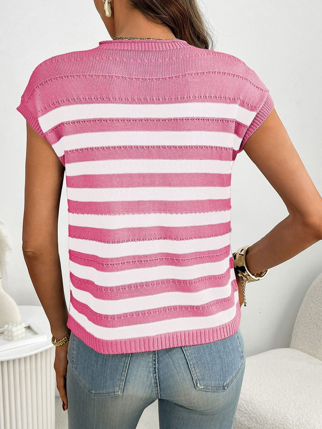 Women's striped knit cap sleeve sweater with pocket detail, featuring cozy outerwear style and trendy design from Trendsi.