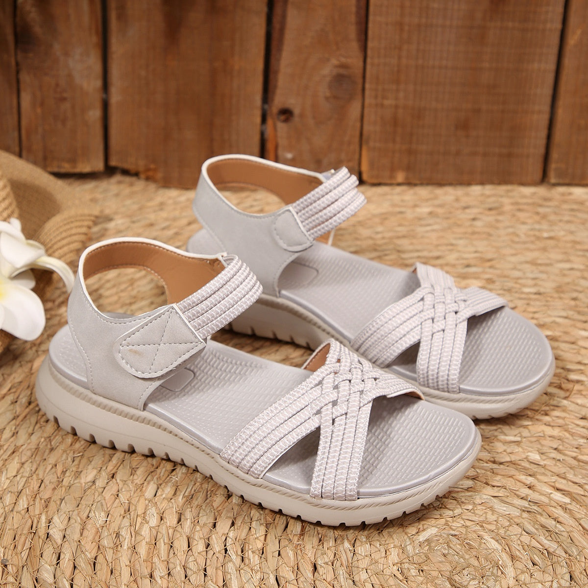 Women's open toe woven strap flat sandals by Trendsi featuring comfortable faux leather slides and stylish design.