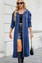 VYSN denim button-up long sleeve longline hooded outerwear with front pockets and stitching details, casual streetwear style.