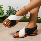 Women's color-block cross-strap flat sandals by FitiqueFit featuring vibrant straps and comfortable flat sole.