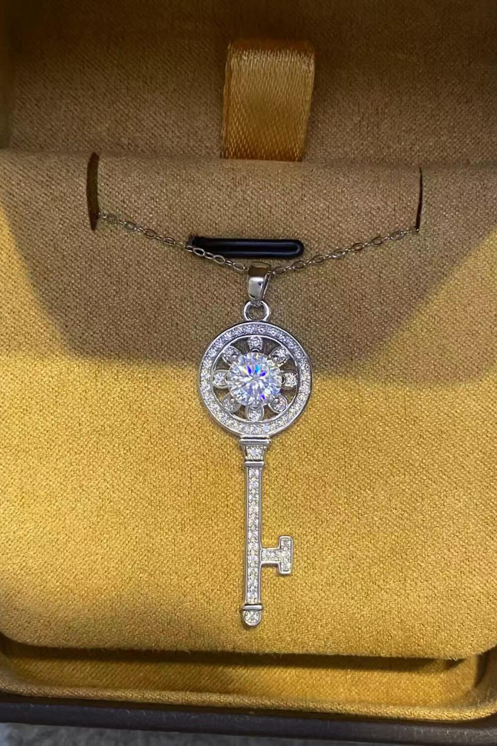 1 Carat Moissanite platinum-plated key pendant necklace featuring a sparkling moissanite gemstone and intricate key design.