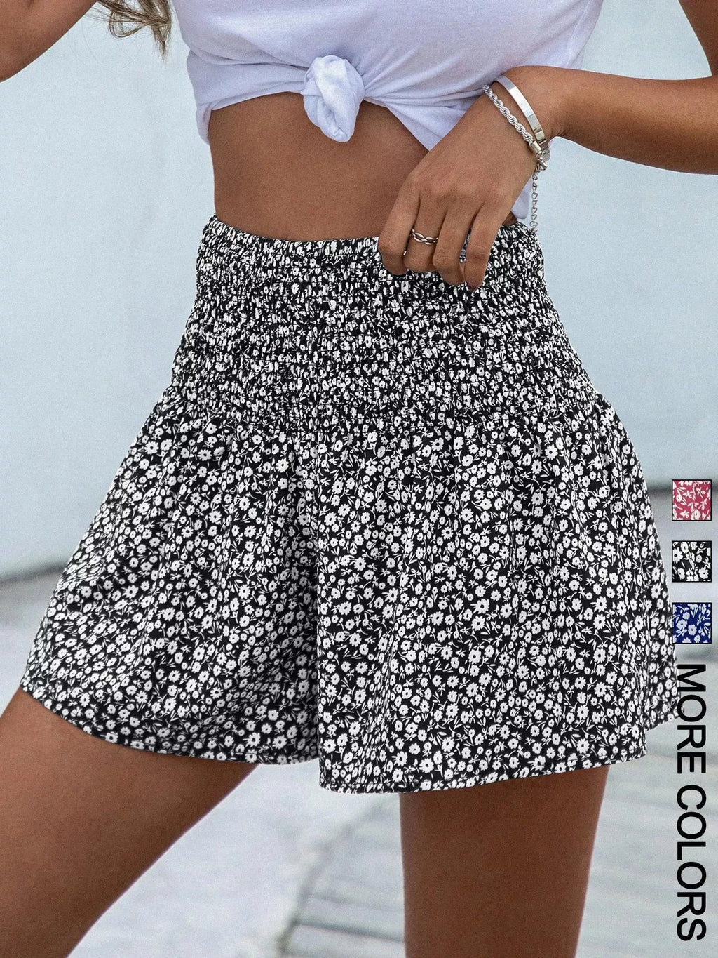 Floral print elastic waist shorts by Trendsi featuring lightweight fabric and a relaxed fit, ideal for casual summer wear.