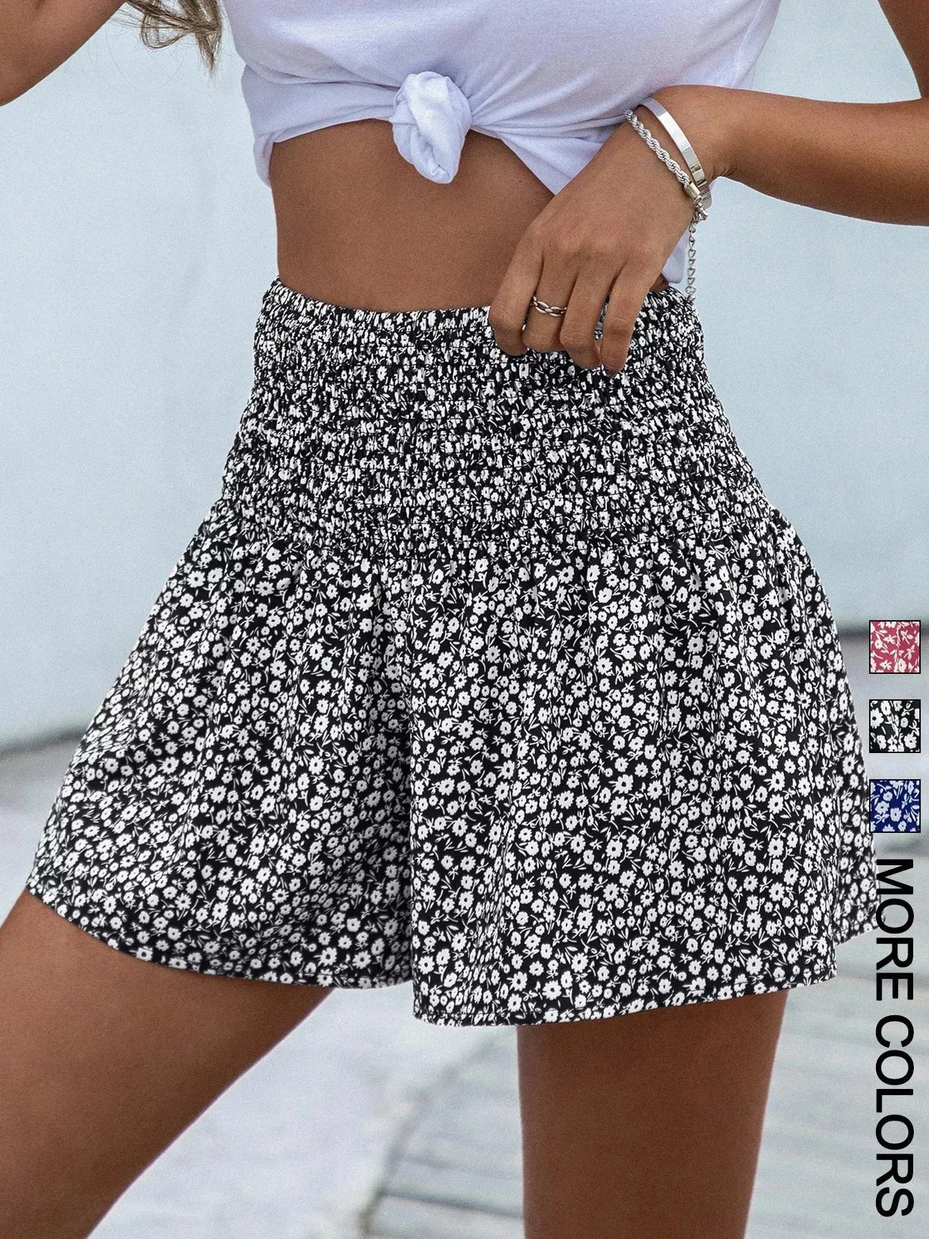 Floral print elastic waist shorts by Trendsi featuring lightweight fabric and a relaxed fit, ideal for casual summer wear.