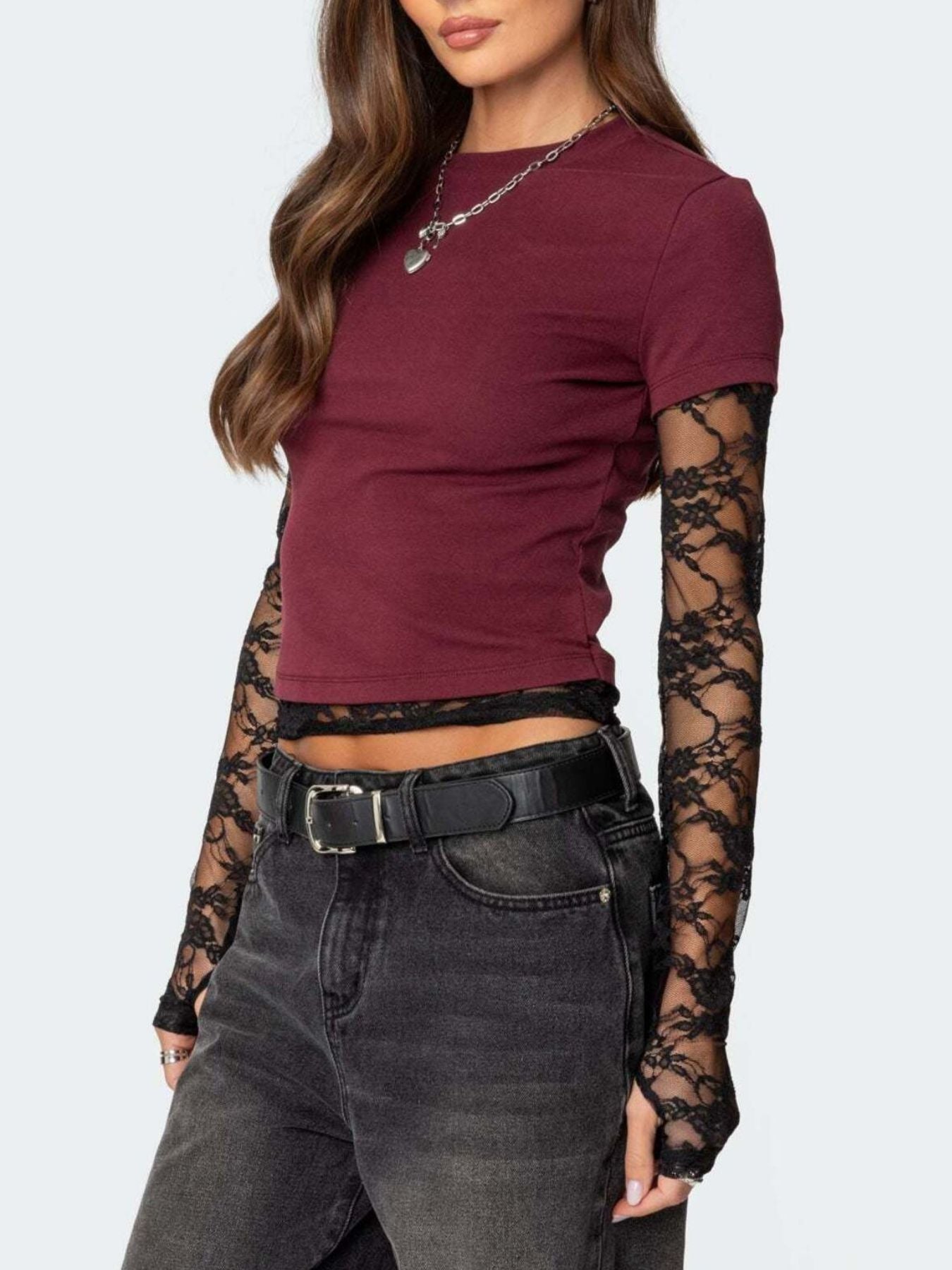 Women's fitted lace sleeve T-shirt by Trendsi featuring a sophisticated casual style and elegant lace details.