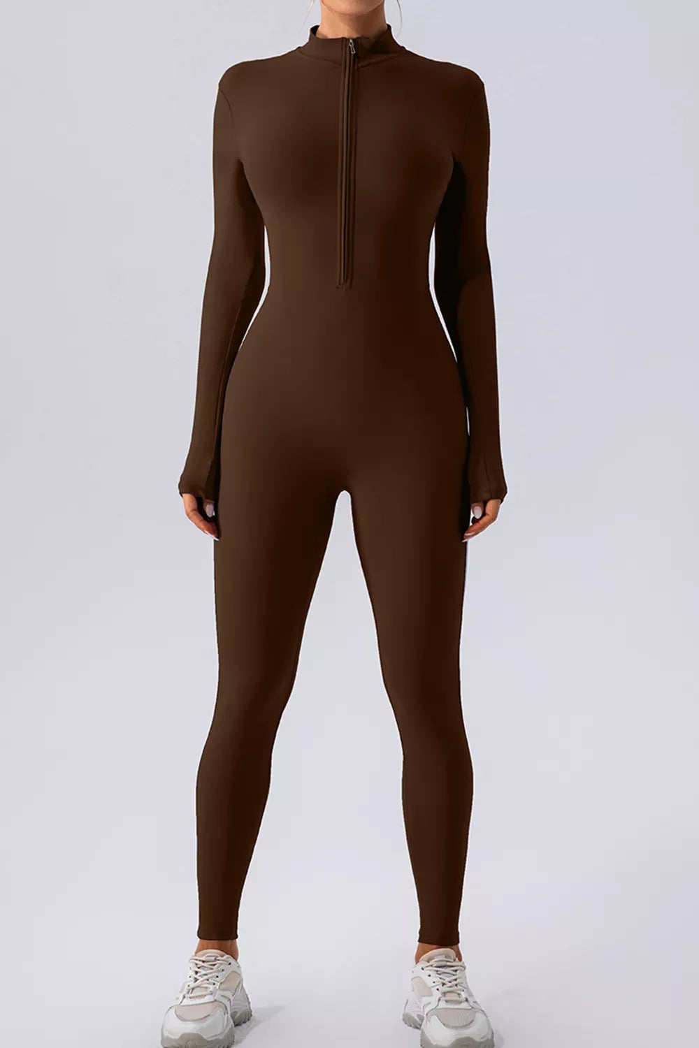 Trendsi half zip mock neck active jumpsuit in sleek athletic fabric, designed for comfortable movement and stylish activewear.