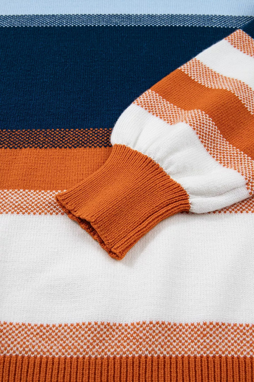 Color block round neck tunic sweater by Trendsi, featuring vibrant color blocks and a cozy knit design for casual wear.