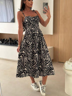 Women's striped tie-shoulder midi dress by Trendsi, casual summer brunch dress with a stylish striped pattern and tie-shoulder design.