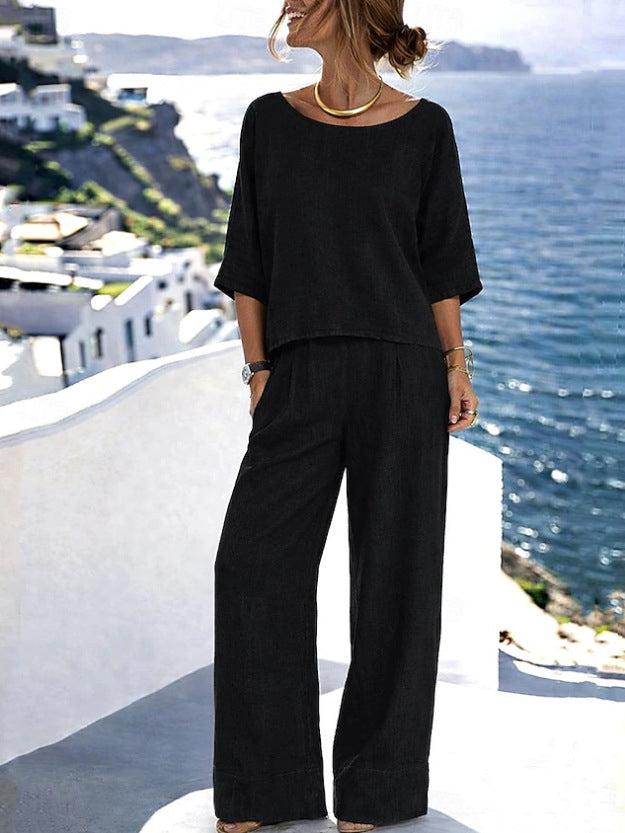 Women's resort set by FitiqueFit featuring a short sleeve top and wide-leg pants, displayed on a mannequin.