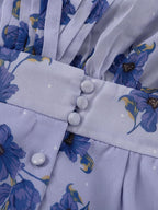 Floral puff sleeve mini dress by Shopimist featuring a vibrant pattern and flowy silhouette on a white background.