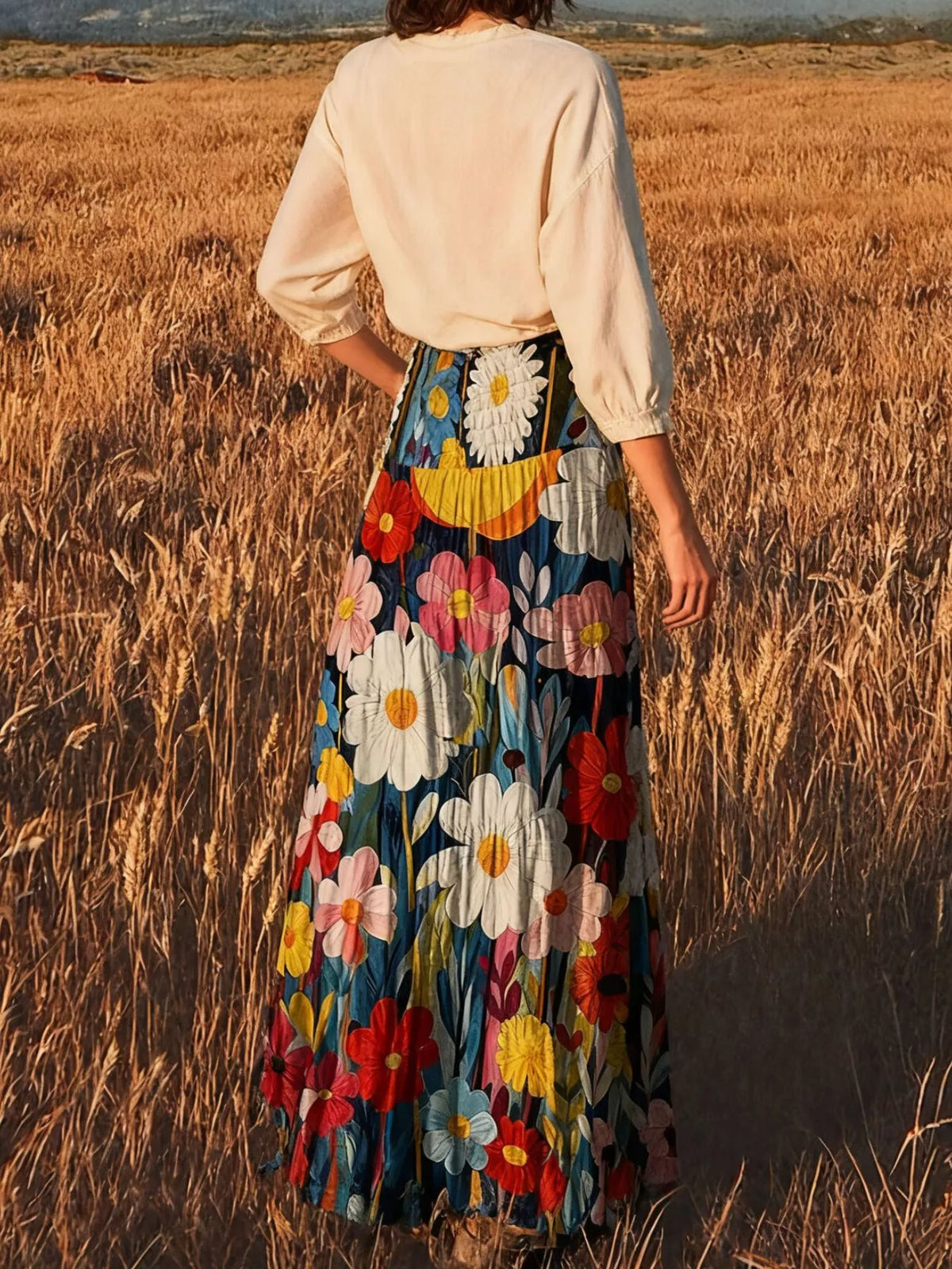 Floral print high-waisted maxi skirt from Trendsi, flowing fabric with vibrant flower patterns, perfect for summer or casual wear.