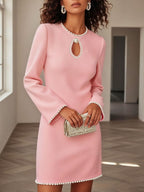 Elegant mini dress with keyhole neckline and pearl trim, chic cocktail party wear by Trendsi, featuring a stylish and sophisticated design.