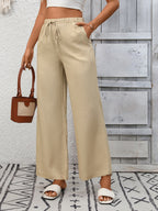 Women's high-waisted wide-leg drawstring pants in soft, breathable viscose fabric, featuring a relaxed fit and comfortable style.