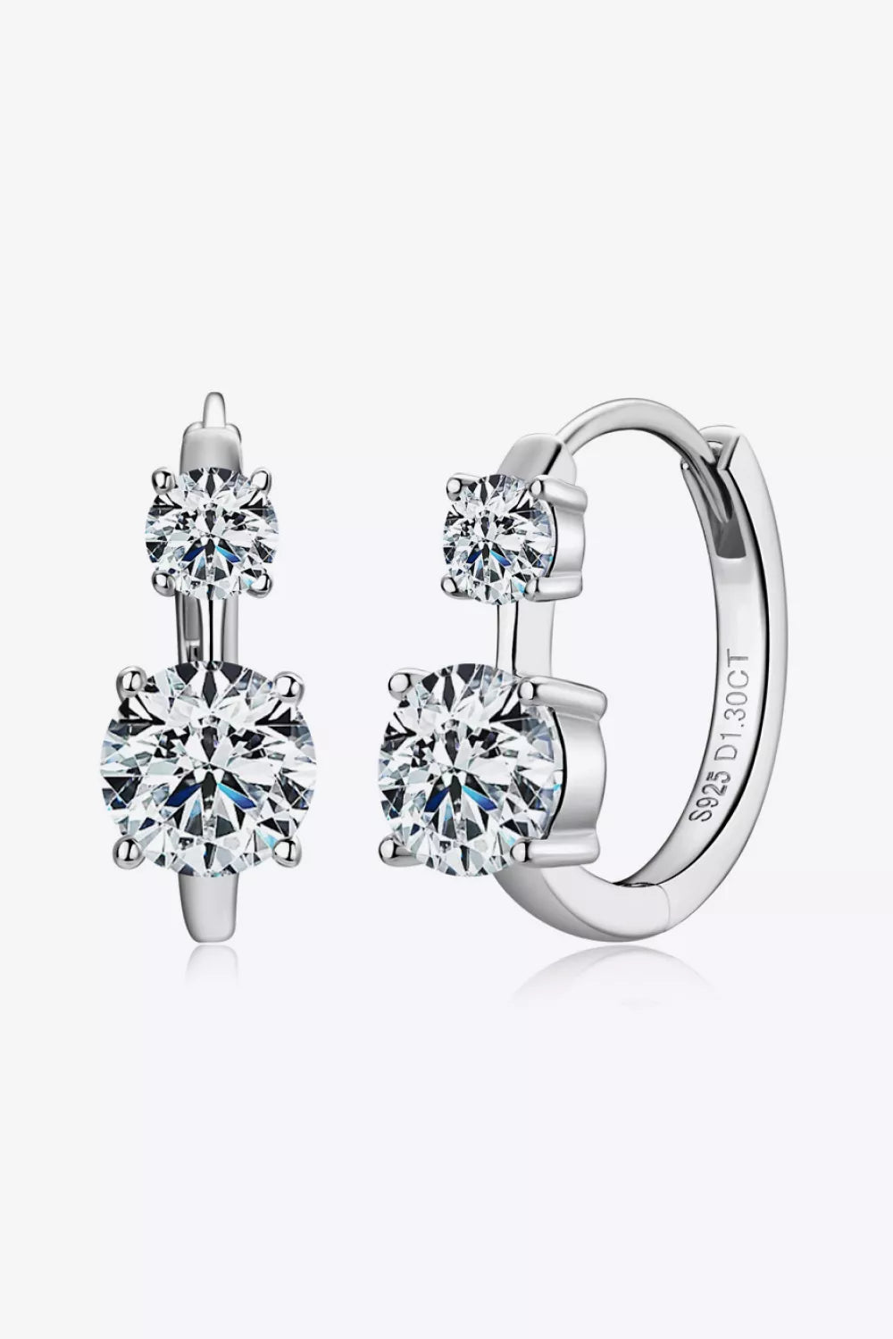 Sterling silver moissanite earrings with 1.3 carats, featuring sparkling gemstones set in elegant silver settings.