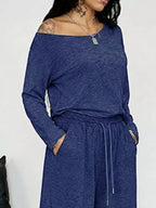Plus size loose fit one-shoulder T-shirt and pants set by Trendsi, featuring comfortable, relaxed-fit pants in a full-size fashion.