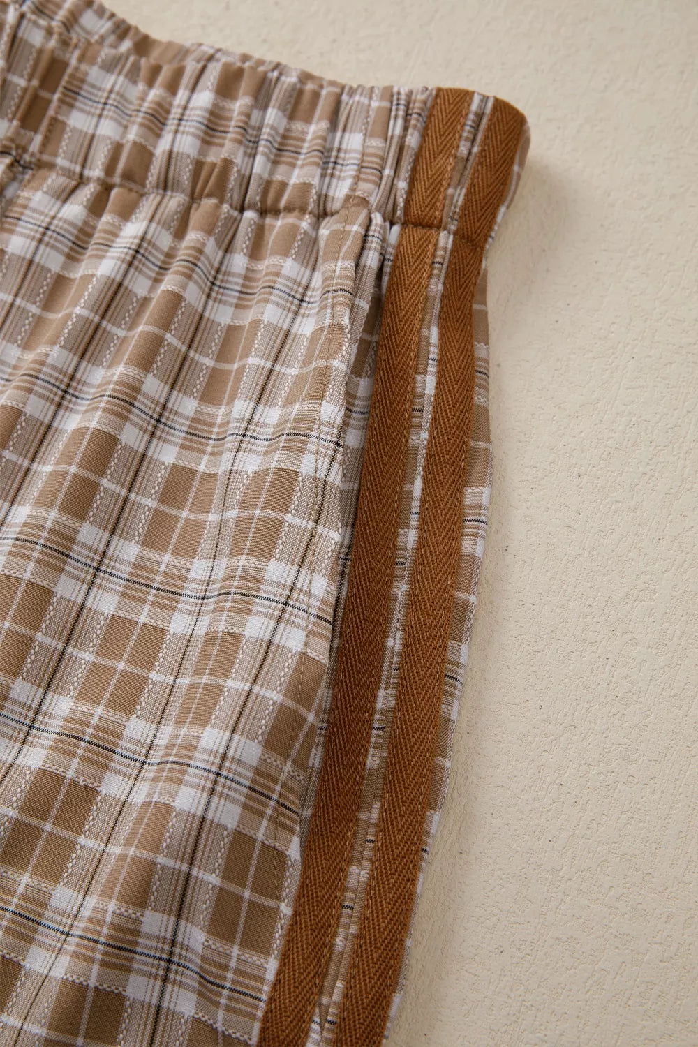Plaid print casual pants with tie detail from Plush Fashion Hub, featuring a relaxed fit and stylish plaid pattern.