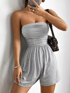Chic strapless romper with ruched waist by Trendsi, featuring a stylish, fitted design perfect for casual or summer wear.