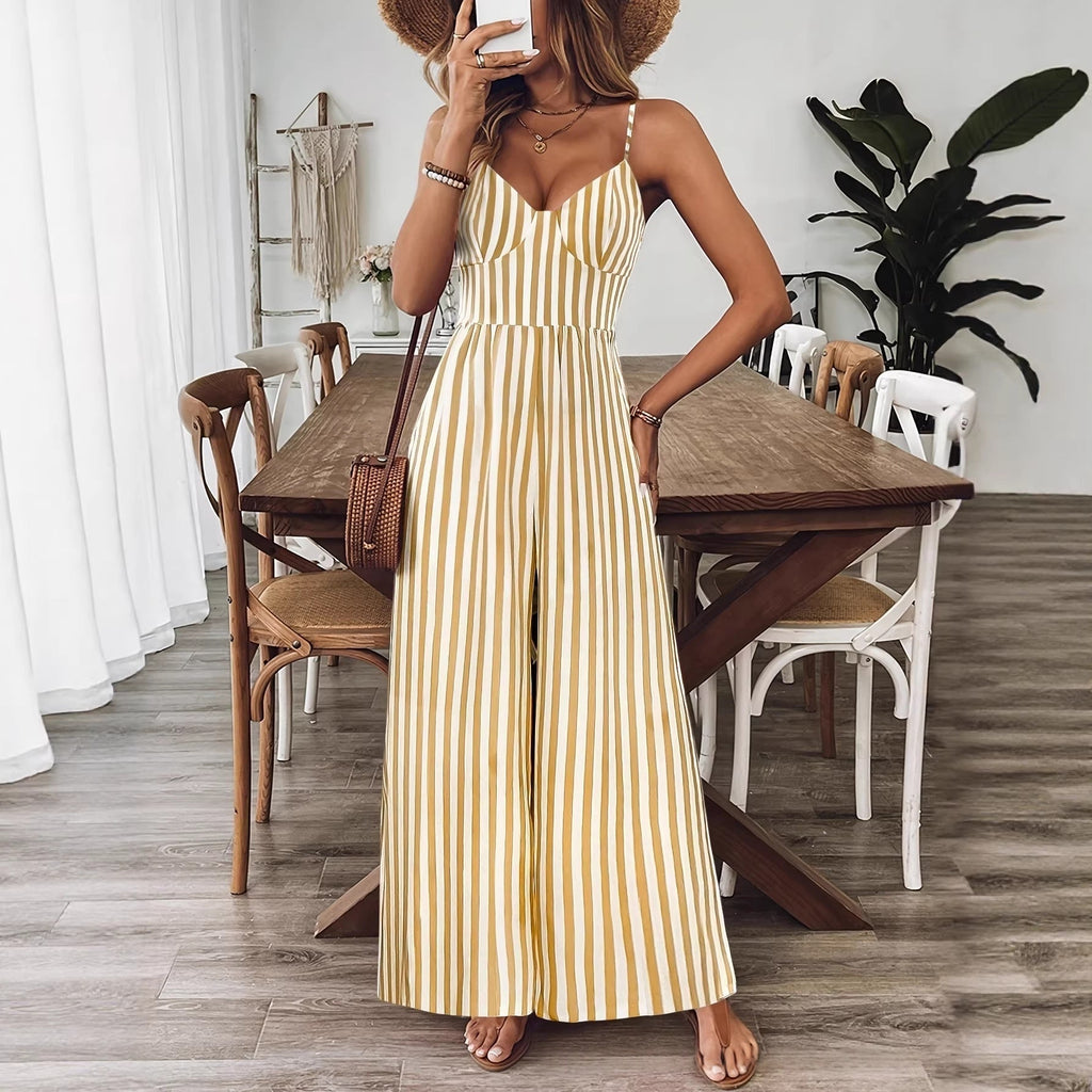 Yellow printed backless sleeveless strap jumpsuit by FitiqueFit, featuring a stylish backless design and slim straps.