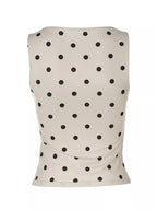 Polka dot tank top by Shopimist featuring a sleeveless design with black and white polka dot pattern.