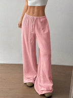 Wide-leg drawstring pants by Trendsi featuring a relaxed fit, lightweight fabric, and adjustable waistband, shown in the image.