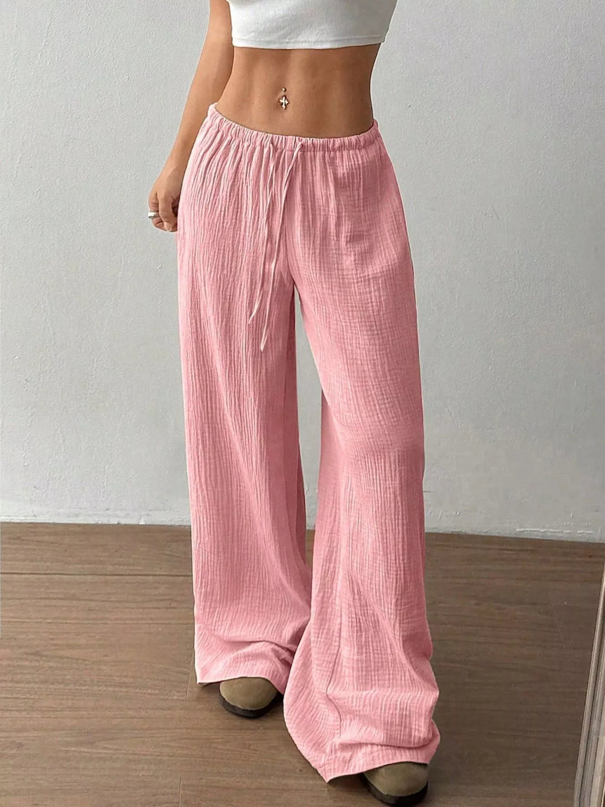 Plush Fashion Hub wide-leg drawstring pants in soft fabric, showcasing relaxed fit and comfortable style.
