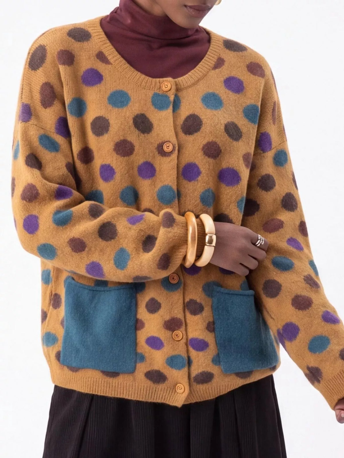 Plus size polka dot button-down cardigan by Trendsi, featuring full size fit and classic design, shown in the image.