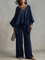 Plus size Trendsi loungewear set featuring a full size V-neck top and matching pants, comfortable and stylish for relaxed wear.