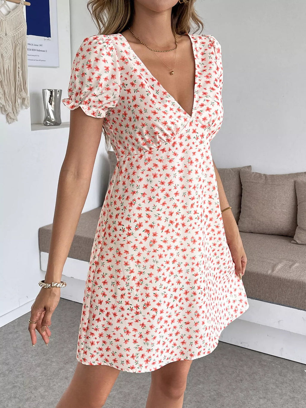 Floral print V-neck puff sleeve mini dress for women, casual summer dress by Trendsi, featuring a feminine and stylish design.